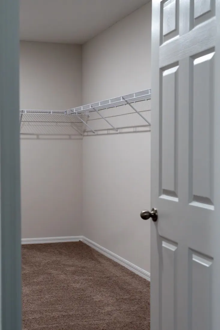 Before: builder-grade wire shelving in an empty closet