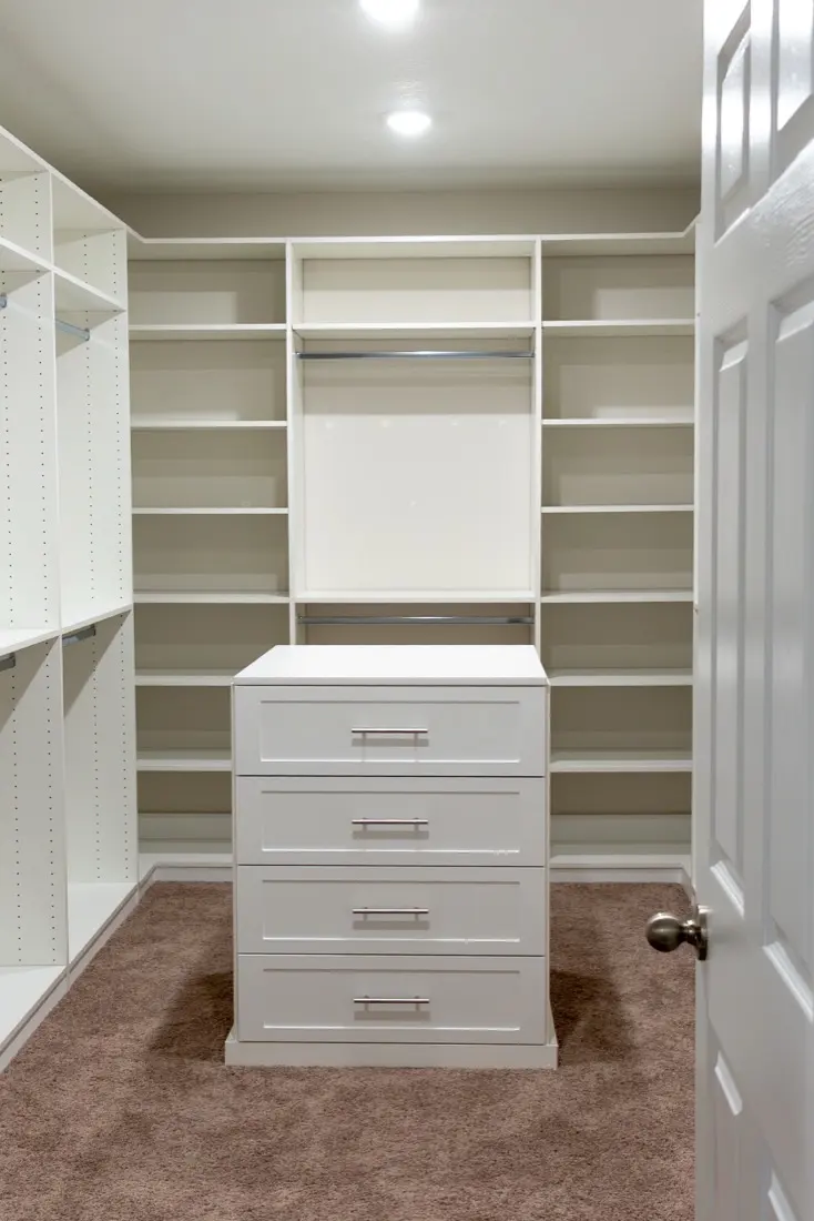 Custom walk-in closet with drawer island installed in Orlando